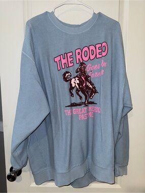 Corduroy Oversized Sweatshirt with Pink Rodeo Graphic - Light Blue